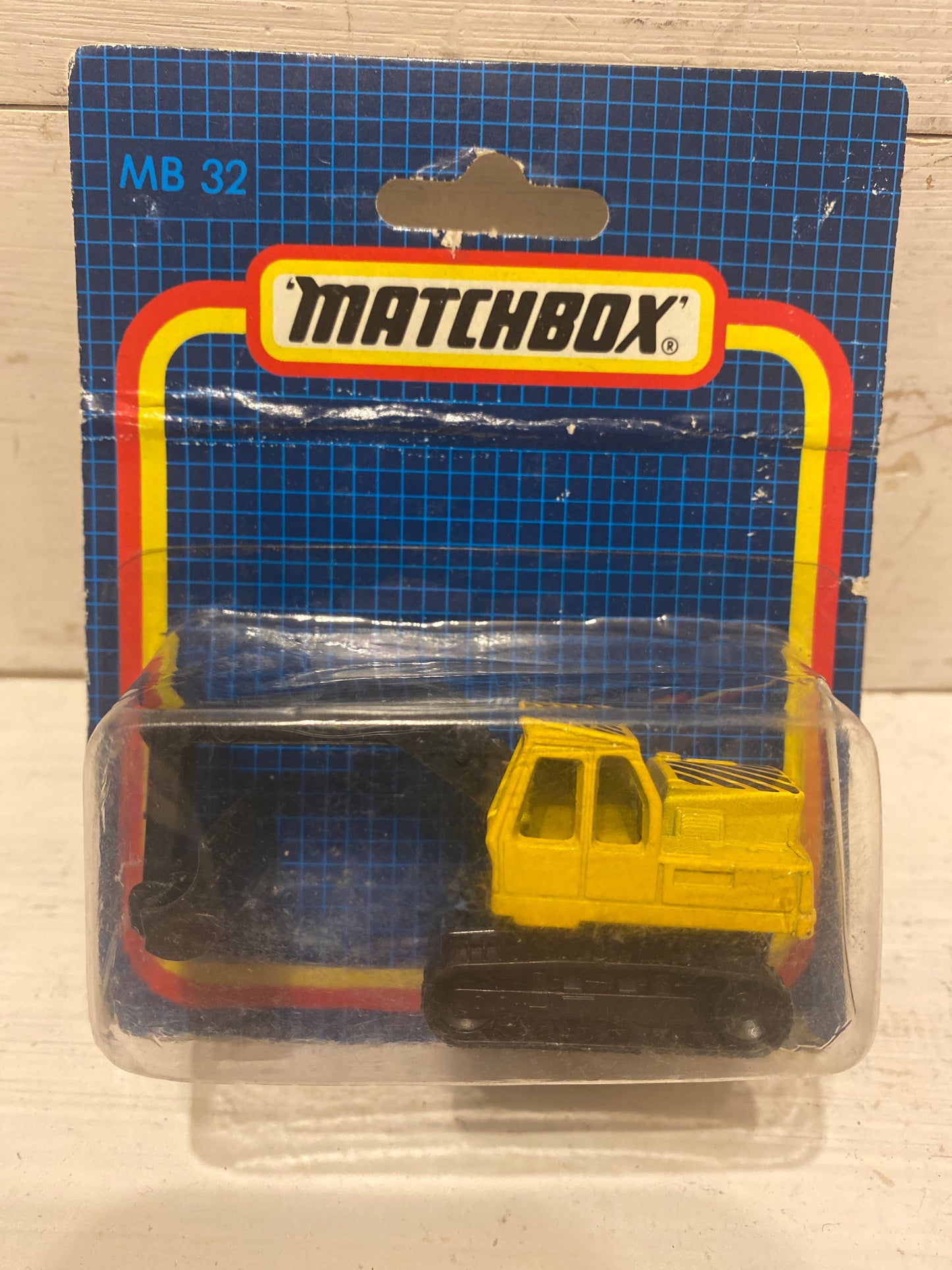 Matchbox Excavator - yellow on rarer European midi card